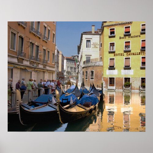 Italy Venice gondolas moored along canal Poster