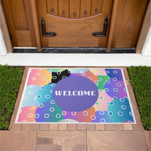 Its a multi_colored pickleball welcome doormat