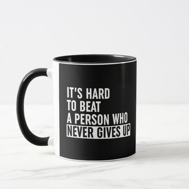 It's Hard To Beat A Person Who Never Gives Up Mug (Left)