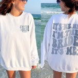 It's Me Hi I'm the Bride Its Me Cool Personalized Sweatshirt<br><div class="desc">Embrace the cool vibes of your bachelorette party with our "It's Me Hi I'm the Bride" Cool Personalized Sweatshirt. Designed for a trendy and groovy bachelorette theme, this sweatshirt is perfect for the bride who wants to make a statement. Featuring a front and back print with retro wavy text and...</div>