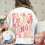 Its Me Hi Im the Maid Of Honor Its Me Personalized Sweatshirt<br><div class="desc">Introducing the "It's Me Hi I'm the Maid of Honor" Personalized Sweatshirt – a trendy and cute peach coral pink garment that adds a touch of fun and style to your Maid of Honor's wardrobe. This cool bachelorette party shirt features a front and back print with retro wavy text, making...</div>