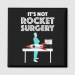 It's Not Rocket Surgery Magnet<br><div class="desc">It’s Not Rocket Surgery. This funny quote accessory is a combination of the sayings “It’s not rocket science” and “It’s not brain surgery”, an example of a malaphor. Great gift for a doctor, surgeon or a med student completing medical school! If you love funny sayings, have a sense of humor...</div>