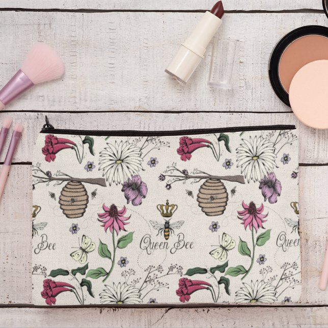Ivory Queen Bee & Gold Crown Accessory Pouch (Chic and Trendy Queen Bee & Exotic Flowers Makeup or Accessory Pouch on an Elegant Ivory Background.)