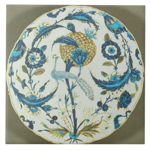 Iznik dish painted with a peacock perched among fl tile