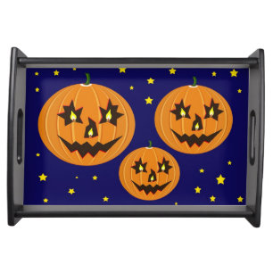 jack-o-lantern halloween pumpkin with candles serving tray