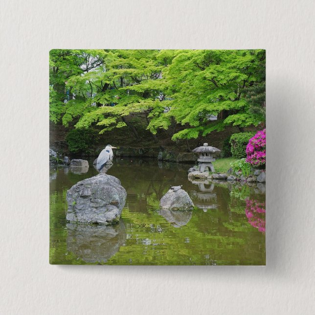 Japan, Kyoto. Heron in fresh green leaves Button (Front)