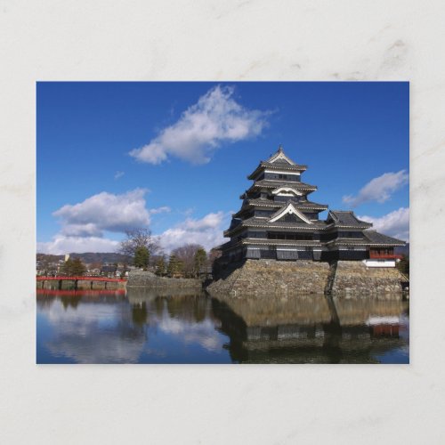 Japanese Castle surrounded by blue castle moat Postcard