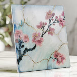 Japanese Cherry Blossom Kintsugi  Ceramic Tile<br><div class="desc">Create a serene and elegant atmosphere with this Japanese-inspired tile featuring soft watercolor cherry blossom branches on a white and light blue backdrop. Delicate gold Kintsugi cracks add a touch of artistry, symbolizing beauty in imperfection. The organic flowing design and subtle brushstroke texture make this tile a perfect choice for...</div>