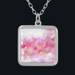 Japanese Cherry Tree with Pastel Pink Blossoms Silver Plated Necklace<br><div class="desc">Springtime fresh floral image. Fancy Japanese cherry tree blossoms in soft delicate pinks and gentle whites. Some bright pink and luminous yellow colored swirls and twinkling lights surround these blossoms giving it a magical dreamy effect, like something from a fairy universe. Faded handwritten text in french gives it a romantic...</div>