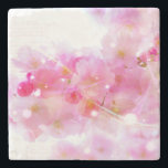 Japanese Cherry Tree with Pastel Pink Blossoms Stone Coaster<br><div class="desc">Springtime fresh floral image. Fancy japanese cherry tree blossoms in soft delicate pinks and gentle whites. Some bright pink and luminous yellow colored swirls and twinkling lights surround these blossoms giving it a magical dreamy effect, like something from a fairy universe. Faded handwritten text in french gives it a romantic...</div>