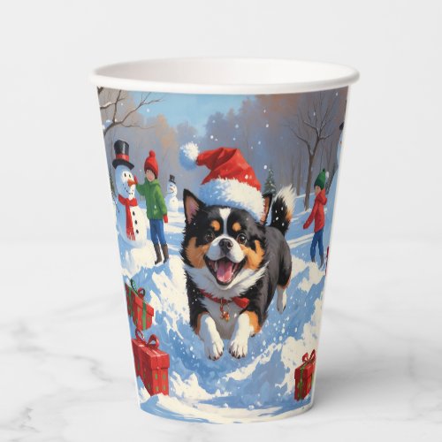 Japanese Chin Running in Snow with Christmas Hat Paper Cups