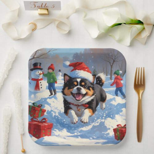 Japanese Chin Running in Snow with Christmas Hat Paper Plates
