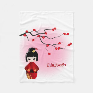 Japanese kokeshi doll at sakura blossoms fleece blanket