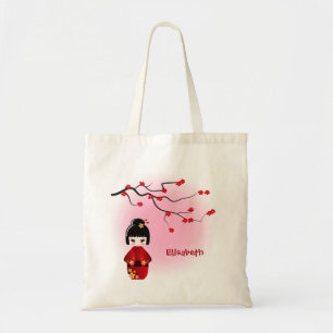 Japanese kokeshi doll at sakura blossoms tote bag