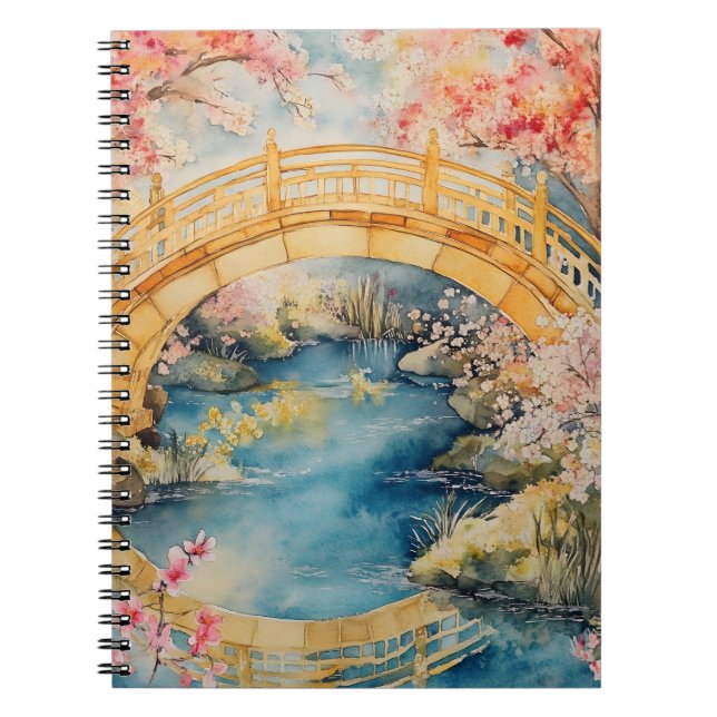 Japanese-style arched bridge spans a tranquil rive notebook (Front)