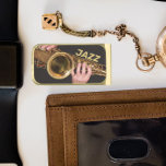 Jazzman Playing Gold Saxophone Gold Finish Money Clip<br><div class="desc">Keep your currency bills together with this metal money clip that features the photo image of a jazzman playing his time-worn, gold colored, tenor saxophone horn along with the word "JAZZ" printed in gold colored block letters. Makes a great gift for a jazz music fan! Select your money clip metal...</div>