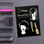 Jazzy Hairstylist Appointment Book Planner<br><div class="desc">Introducing the Jazzy Hairstylist Appointment Book Planner, your ultimate companion for stylish and organized salon scheduling! With its eye-catching design featuring glitter combs and brushes, adorned with two elegant white silhouette women showcasing their fabulous hairstyles, this planner is as fashionable as it is functional. •Stay on top of your appointments...</div>