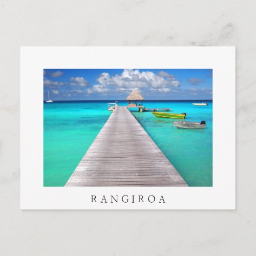 Jetty with boats in a tropical lagoon postcard