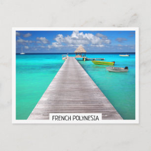 Jetty with boats in a tropical lagoon postcard