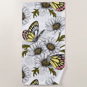 Jezebel butterflies and daisy flowers on white beach towel