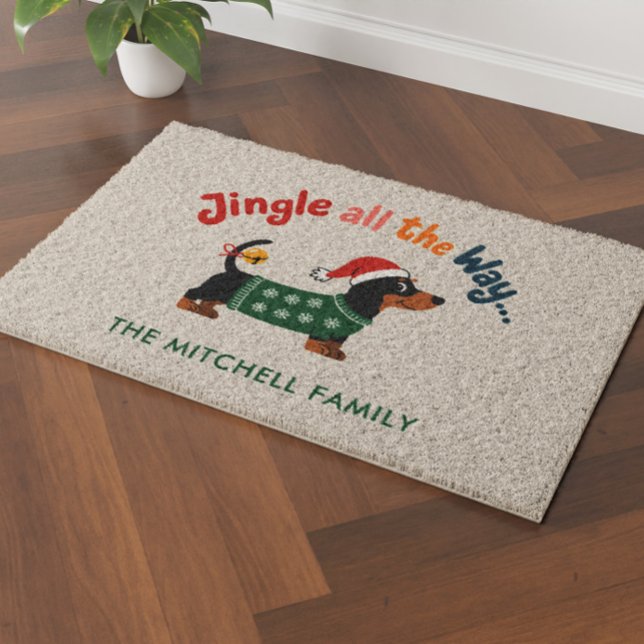 Jingle All the Way – Dachshund Holiday Family Name Fiber Doormat (Holiday coir doormat with a dachshund in a Santa hat and green sweater, “Jingle all the Way...” )