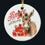 Jingle All the Way Donkey Christmas Ceramic Ornament<br><div class="desc">This unique Christmas ornament features a cute donkey holding a present with the phrase "Jingle All the Way" written in vintage-style lettering. It's a fun and festive addition to any Christmas tree.</div>