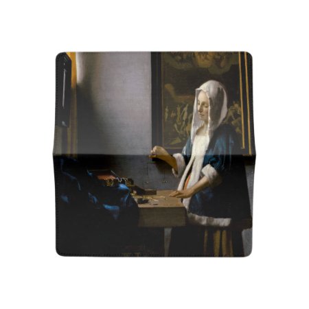 Johannes Vermeer - Woman Holding A Balance Checkbook Cover
