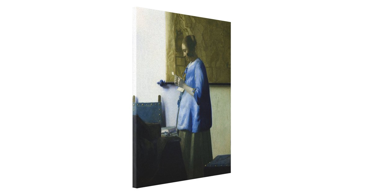 woman in blue reading a letter