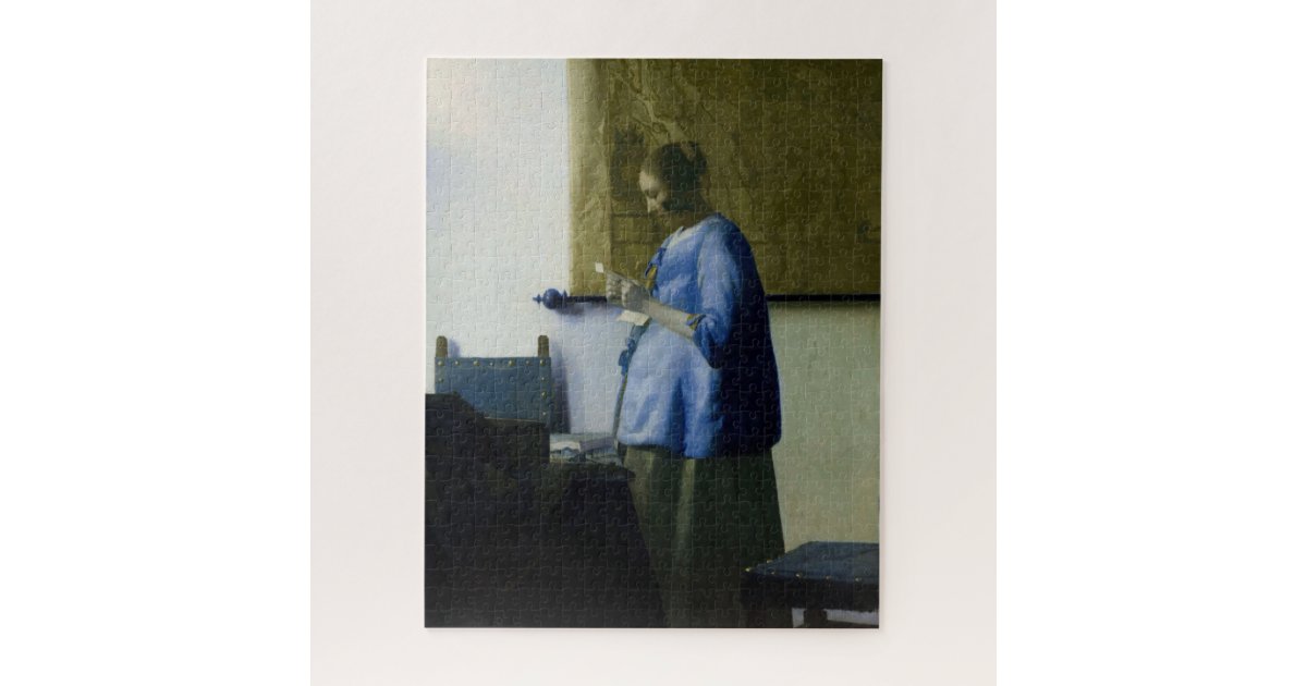 woman in blue reading a letter