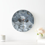 Jolly Christmas Snowman Delight Large Clock<br><div class="desc">A charming snowman with a cheerful expression and a cozy hat stands proudly amid a serene winter landscape. Majestic mountains create a stunning backdrop,  while delicate stars twinkle in a night sky. A miniature tree enhances the festive atmosphere.</div>