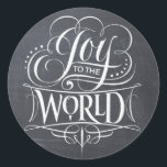 JOY Chalkboard Christmas Calligraphy Lettering Classic Round Sticker<br><div class="desc">JOY TO THE WORLD. Whenever I sing this Christmas carol, the 'Joy' portion is always so much fun. It comes out in full strength and with… JOY. That was the inspiration for this marvelous piece of chalk calligraphy art by professional lettering artist Ivan Angelic. This is the chalkboard version, there...</div>