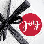 Joy cute script simple typography red Christmas Classic Round Sticker<br><div class="desc">Christmas holiday stickers featuring the word "joy" in an elegant white script over a red background. All colors are customizable in the design tool.</div>