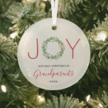 Joy Wreath Our First Christmas as Grandparents Glass Ornament<br><div class="desc">Elegant holiday ornament featuring "JOY" with the letters "J" and "Y" in a red sans serif font and a watercolor painted greenery wreath as the letter "O". Below is "Our First Christmas as Grandparents" along with the year.  This cute ornament is a perfect gift for new grandparents.</div>