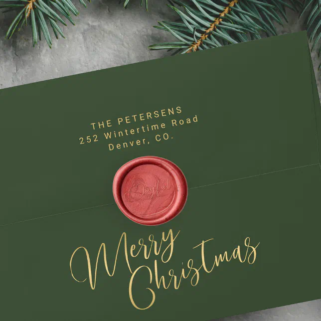 A red wax seal is shown on a green envelope with some greenery in the background.