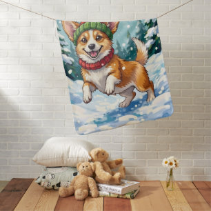 Joyful Corgi Dog Bouncing in Snow with Pom Pom Baby Blanket