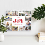 Joyful Year | Photo Calendar<br><div class="desc">Share a favorite memory on each page of this photo calendar. Cover features a thumbnail version of each photo with "a year of joy" in the center in festive red lettering. A red snowflake takes the place of the "O" for extra holiday cheer. Personalize the cover with your name(s) or...</div>