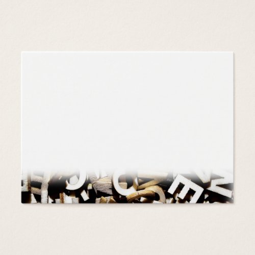 Jumbled letters made of wood close up business card