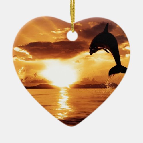 jumping dolphin with beautiful sunset over the sea ceramic ornament