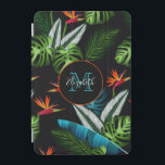 Jungle safari green foliage leaves black iPad mini cover<br><div class="desc">A chic black background.  Green and blue tropical rain forest,  jungle. Palm tree and banana leaves,  foliage with red and orange florals,  flowers.  A black and orange frame with space for your name and monogram letter.  The name is written with a modern hand lettered style script.</div>