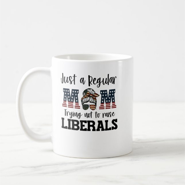 Just a regular mom trying not to raise liberals sh coffee mug (Left)
