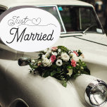 Just Married Oval Car Magnet<br><div class="desc">Just Married—fun car magnet. Elegant script font with a cute heart tale. Simple and sweet black lettering. Order one for all sides of your car and let people know you just got married!</div>
