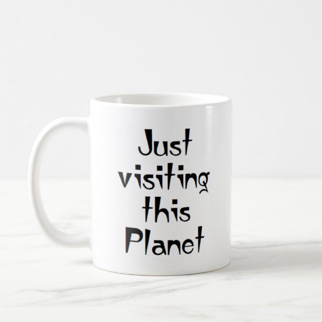 just visiting this planet coffee mug (Left)