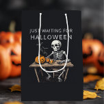 "Just Waiting for Halloween | Funny Skeleton Medium Gift Bag<br><div class="desc">Wrap your Halloween gifts in style with this "Just Waiting for Halloween" Medium Gift Bag. Featuring a playful skeleton design, this gift bag is perfect for adding a spooky and festive touch to your Halloween presents. Made from sturdy, high-quality paper with strong handles, this bag is both durable and eye-catching....</div>