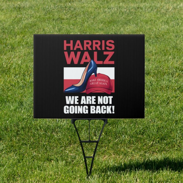 Kamala Harris Heels Stepping On Red MAGA Hat   Sign (Insitu)