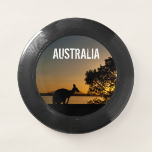 Kangaroo silhouette at sunset, black Wham-O frisbee