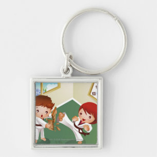 Karate boy holding wood with another breaking it keychain