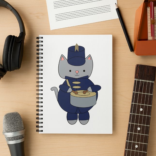 Kawaii Grey Cat Marching Band Drummer Illustration Notebook (A notebook featuring a gray cat playing drums in a navy blue & gold marching band uniform.)