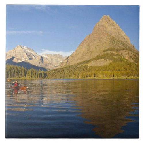 Kayaking in Swiftcurrent Lake at sunrise in the Ceramic Tile
