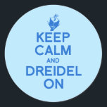 KEEP CALM AND DREIDEL ON CLASSIC ROUND STICKER<br><div class="desc">Happy Holigays! Shop Holiday Humor, LGBTQ Designs and Funny Christmas Gifts From LGBTShirts.com Shop for Everyone and Browse over 10, 000 LGBTQ Gifts, Holiday Humor, Equality, Slang, & Culture Designs. The Most Unique Gay, Lesbian Bi, Trans, Queer, and Intersexed Apparel on the web. SHOP MORE LGBTQ Designs and Gifts at:...</div>