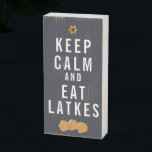 Keep Calm and Eat Latkes | Hanukkah Typography Wooden Box Sign<br><div class="desc">Hanukkah... The festival of lights is here. Light the menorah, play with the dreidel and feast on latkes and sufganiyot. Celebrate the spirit of Hanukkah with friends, family. Add your custom wording to this design by using the "Edit this design template" boxes on the right hand side of the item,...</div>